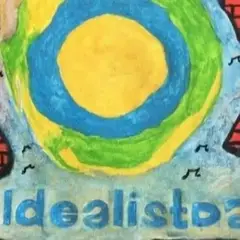 Uma pintura do logotipo da Idealist em uma parede de tijolos.