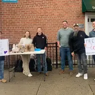 A group of individuals from Hope Community in Brooklyn, NY hand out free coffee and donuts to neighbors.
