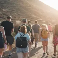 Group of people walking on a trail